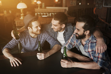 happy male friends drinking beer at bar or pub - obrazy, fototapety, plakaty