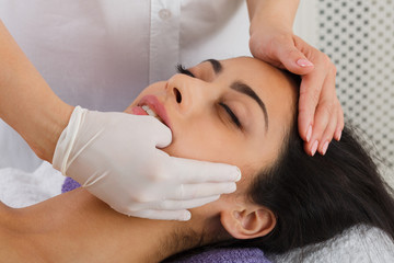 Obraz na płótnie Canvas Doctor make Intra oral massage in spa wellness center