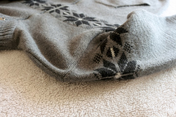 Warm men's sweater with ornament.