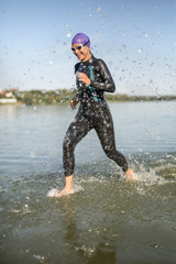 Sportive girl runs on the water