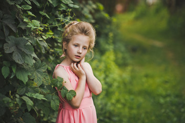 A childs portrait set amidst a blossomed garden 6661.