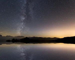  Tranquil landscape with star reflection and milky way © aljndr