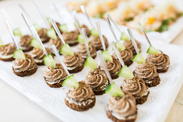 close up of canape with paste on serving tray
