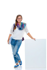 Beautiful student woman pointing on blank board