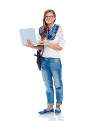 Smiling teenager with laptop on white background