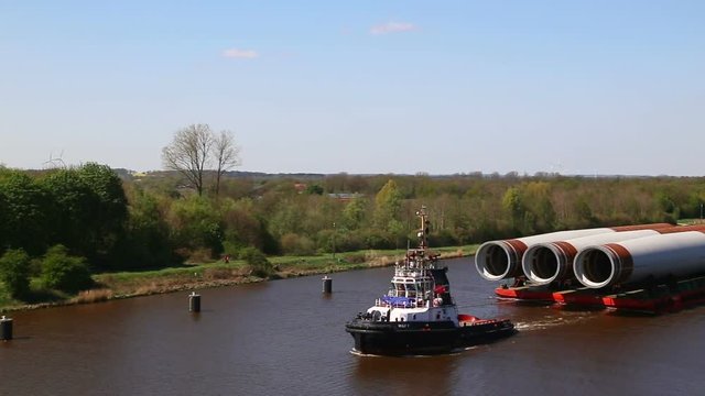 Tug Boat Tow Barge With Pipes