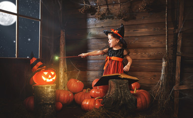 Halloween. child little witch with magic wand, pumpkin Jack  mag