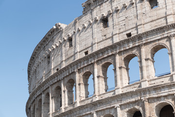 Fototapeta na wymiar Rome, Italy - July 8, 2016: the Colosseum or Coliseum, Flavian Amphitheatre, is an oval amphitheatre in the centre of Rome, Italy. Built of concrete and sand, it is the largest amphitheatre ever built