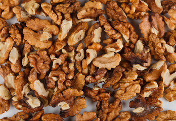 Pile of peeled walnuts close-up as abstract food background