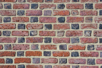 Red brick wall grunge texture.