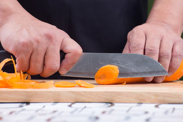 Chef is cutting carrots