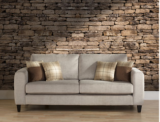 Sofa in Lounge with stone wall