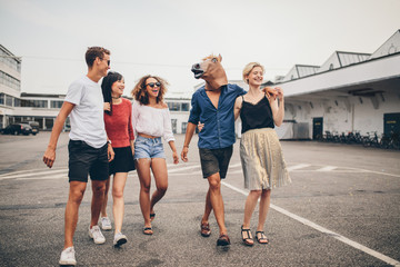 Young friends enjoying together on the street