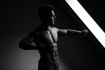 Fototapeta na wymiar Sexy muscular man with belt