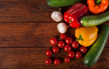 Fresh vegetables on brown wood background with copy space