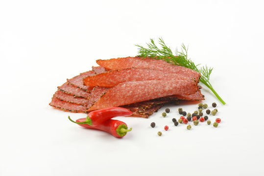 Thin sliced pepper coated salami