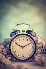 Alarm clock in a wastepaper