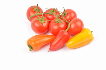 Fresh sweet pepper, tomato. On a white background.