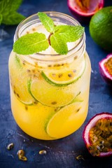 tropical cocktail with passion fruit, lime and mint