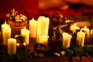 Still life with burning candles and massage herbs. Spa natural spaa still life for massage.