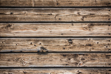 Fototapeta premium Brown wooden desks wall background.