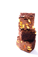 Top view of a stack of brownies on a white background.