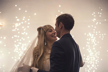 happy bride and groom dancing the first dance