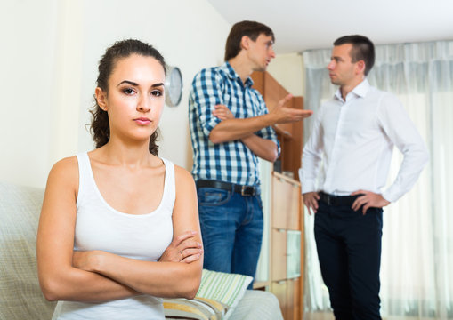 Two Young Men And Unhappy Girl