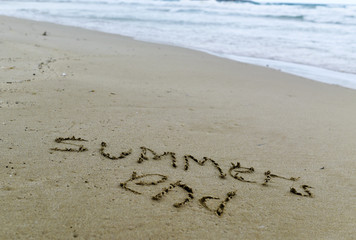 text summers end in the sand of a beach