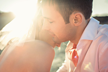 groom and bride hugging  each other