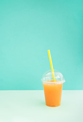 take away glass with citrus juice