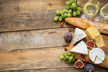 wine and snacks on wooden table