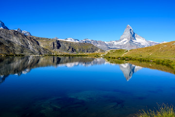 Naklejka na ściany i meble Stellisee - beautiful lake with reflection of Matterhorn - Zermatt, Switzerland
