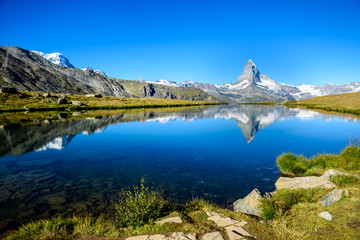 Fototapeta na wymiar Stellisee - beautiful lake with reflection of Matterhorn - Zermatt, Switzerland