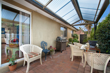 back yard with outdoor seating and barbecue with family