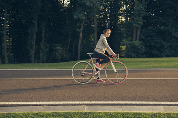 Active  woman riding a bicycle