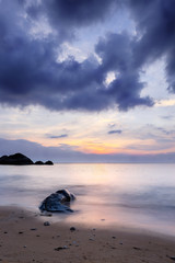 Fototapeta na wymiar Long exposure sunset at exotic tropical island. Sand, stone and