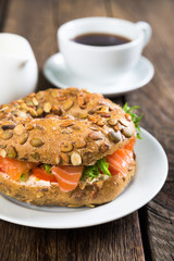 Bagels with cream cheese and smoked salmon with vegetables