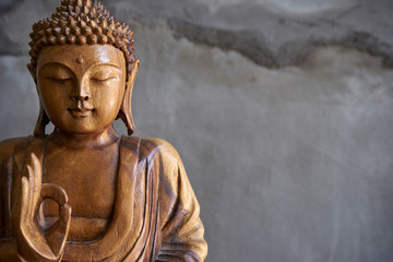 Wooden buddha statue - obrazy, fototapety, plakaty