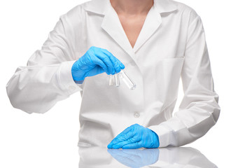Doctor in gown and gloves holding three ampoules with drug