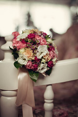 colored bouquet of flowers lying on the chair