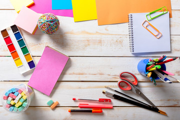 School tools. On a wooden background.