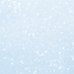 Unfocused abstract light blue glitter bokeh holiday background. Winter xmas holidays. Christmas.