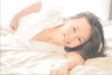 close up portrait of Asian woman on white shirt  lay down on whi