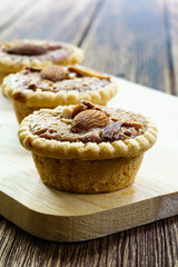 Homemade Almonds tart on wooden table background