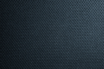 Deep blue fishnet cloth material as a texture background. Nylon texture pattern or nylon background for design with copy space for text or image.