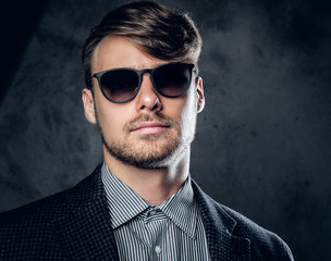 Portrait of glamour male in sunglasses.