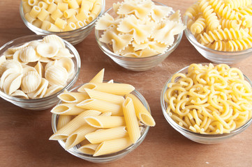 Various types of dry pasta of different shapes