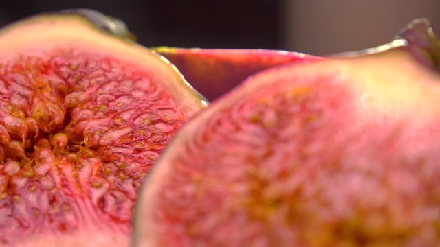 Cut ripe figs 4K macro pan shot