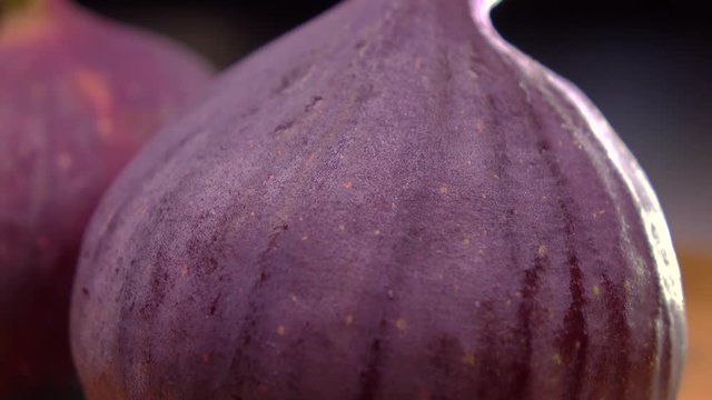 Figs on cutting board. 4K macro pan video